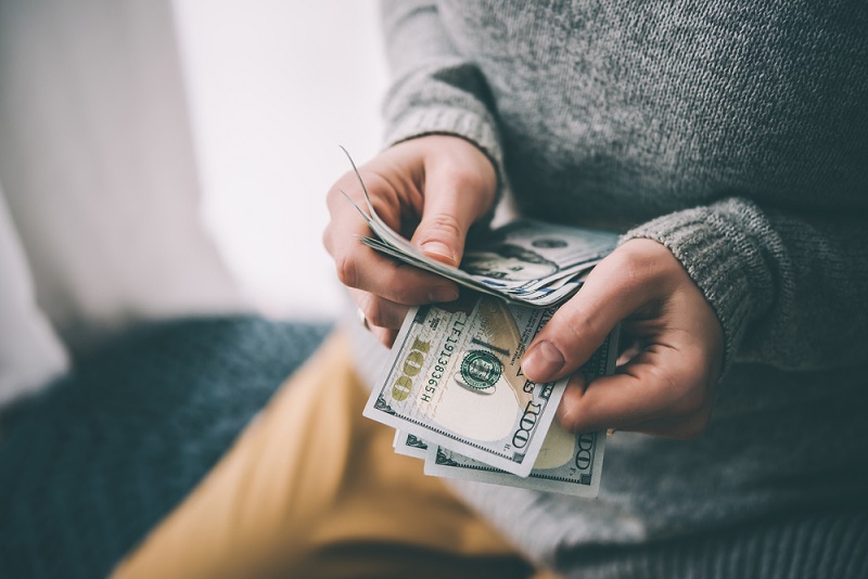 saving-cash-holding-money.jpg