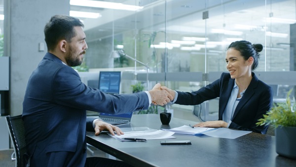 Lender and business owner shaking hands